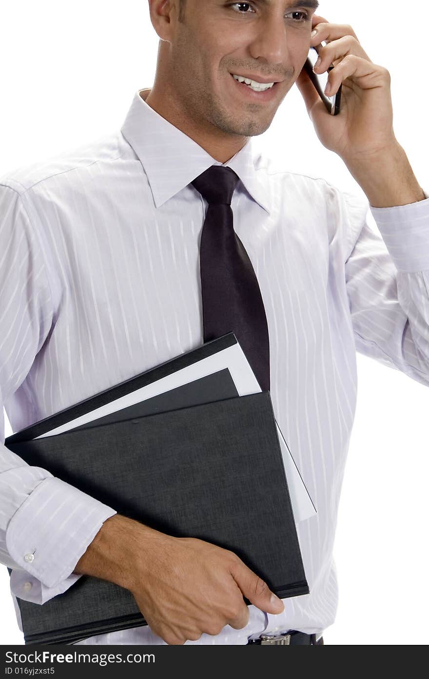 Successful businessman busy on phone call on an isolated white background