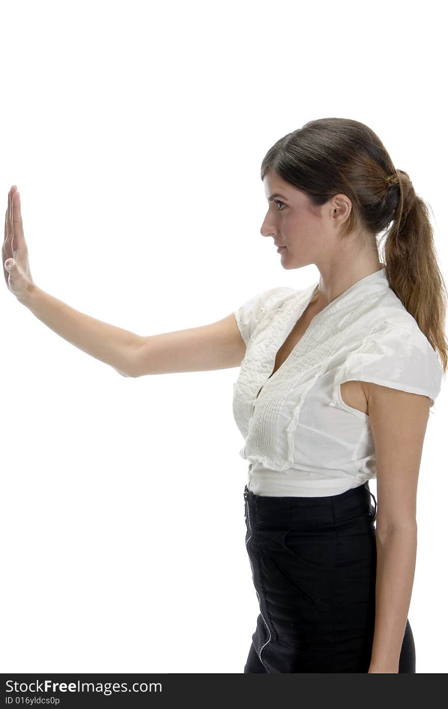 Woman posing with stopping palm