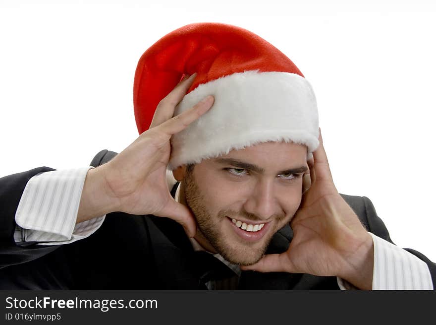 Man Posing With Santa Cap And Holding His Face