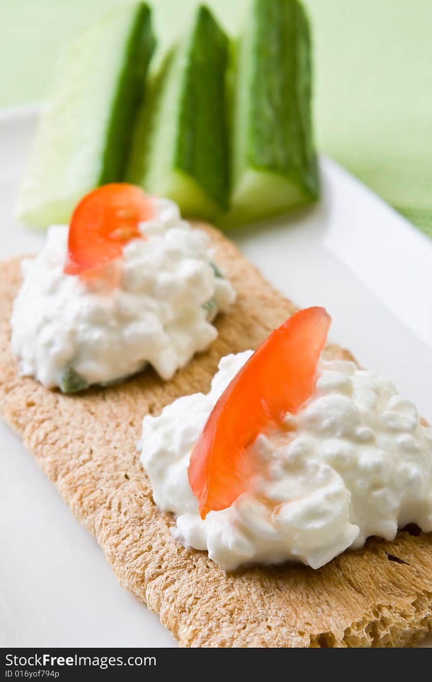 Cottage cheese on crispbread with tomato. Cottage cheese on crispbread with tomato