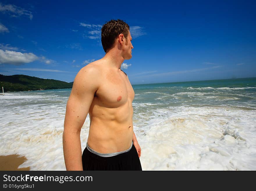 Man standing on exotic beach