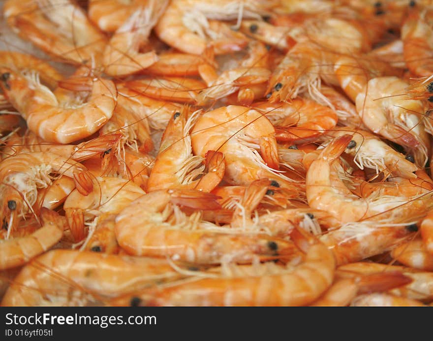 Fresh prawn shrimps on display as a background in market in France