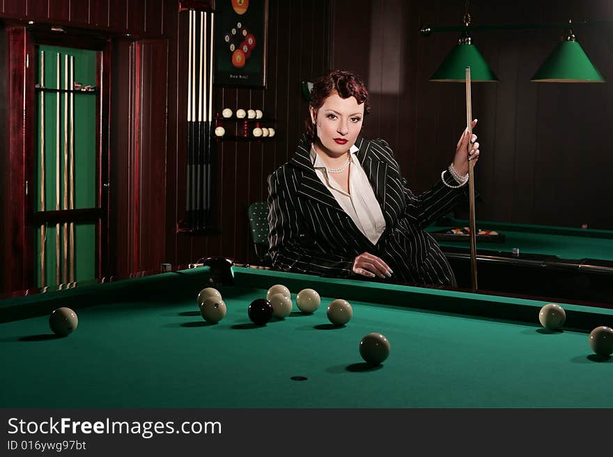 Beautiful girl near the billiard-table. Beautiful girl near the billiard-table