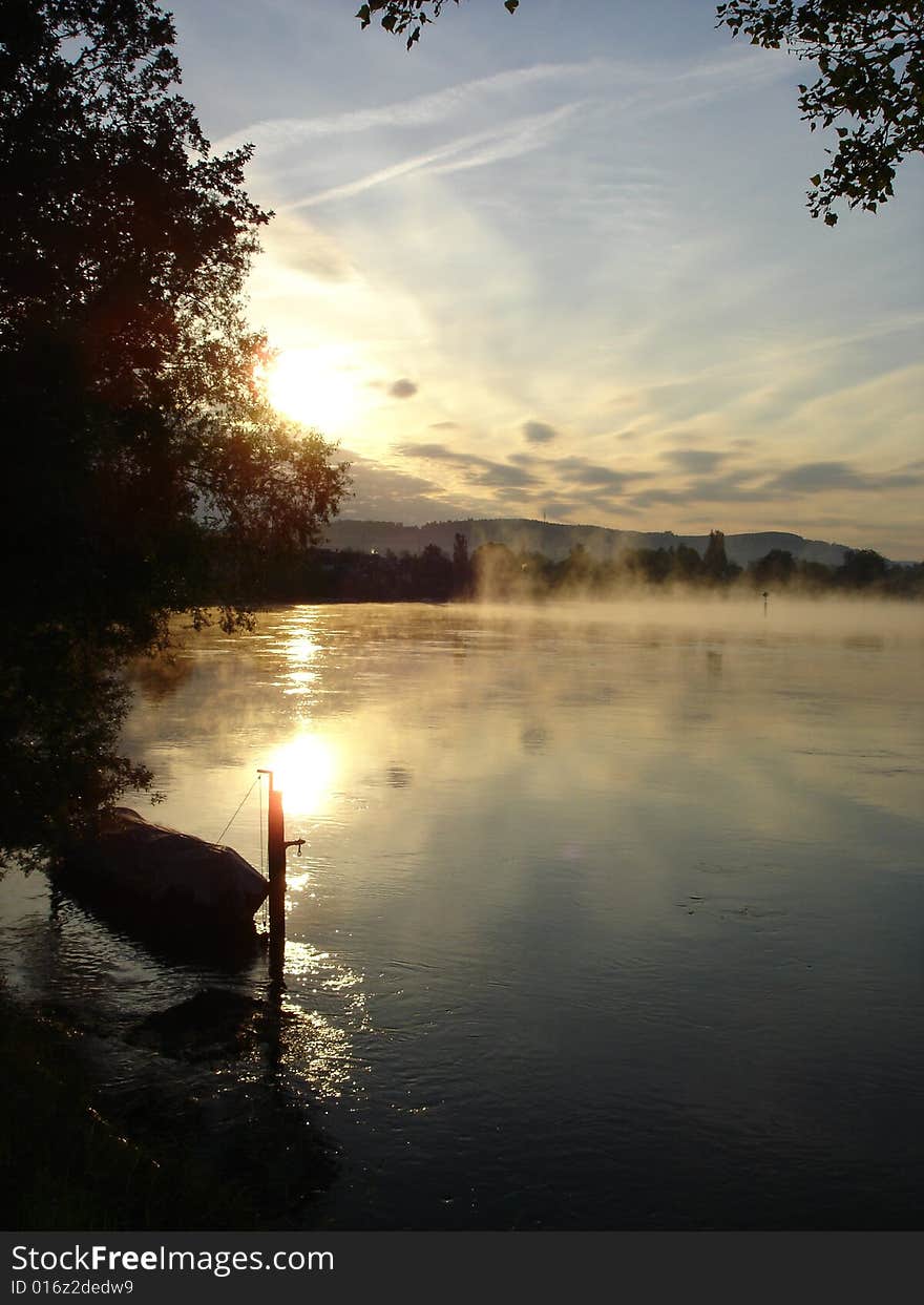 Fog rises over the Rhine River at the German town of Büsingen at dawn. Fog rises over the Rhine River at the German town of Büsingen at dawn.