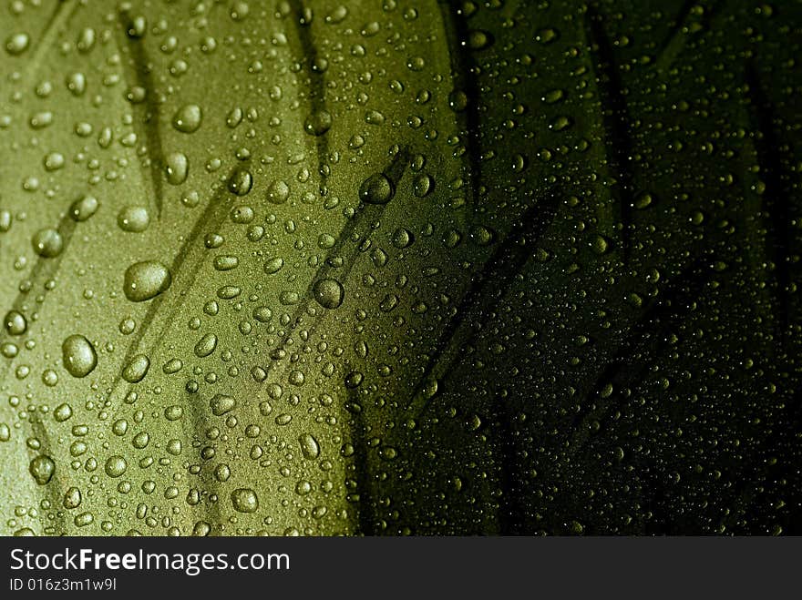 Waterdrops on a steel like surface with lights from below. Waterdrops on a steel like surface with lights from below