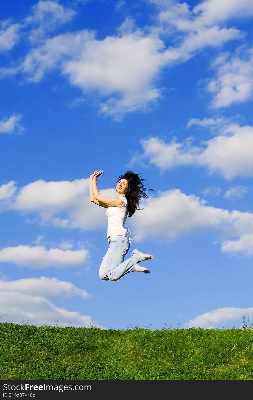 Pretty young woman is jumping