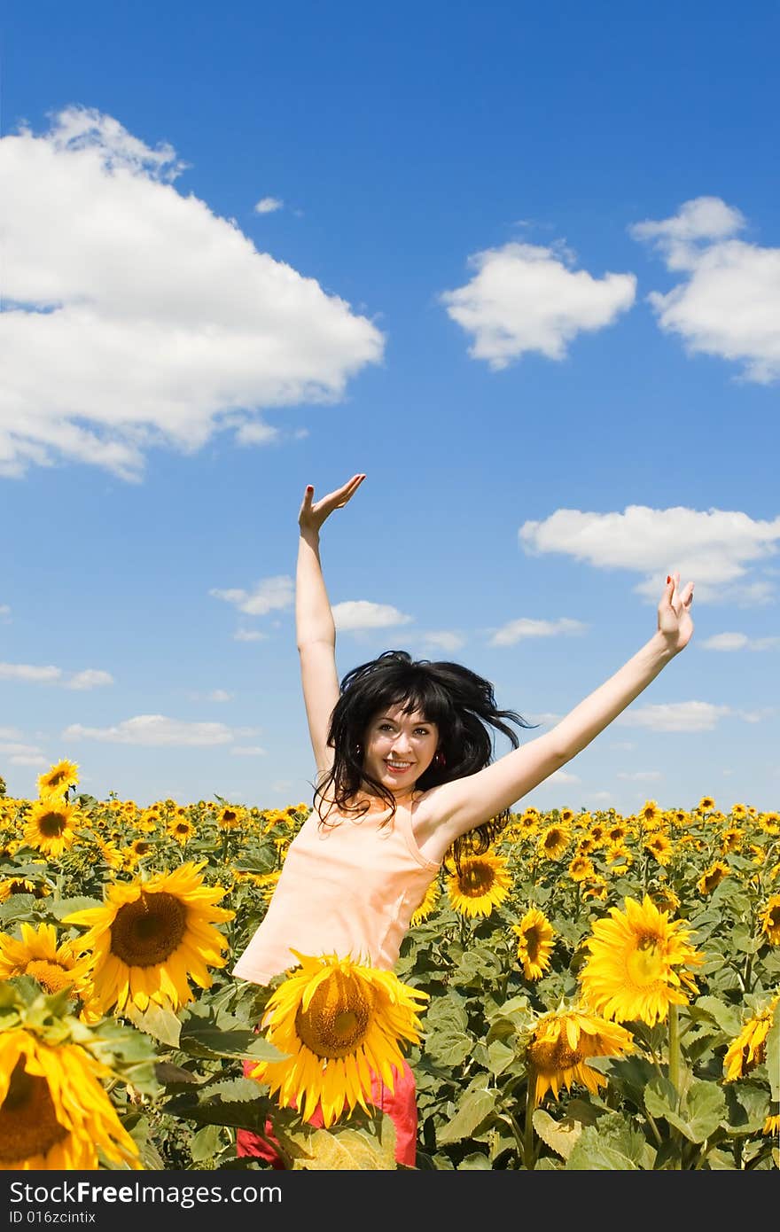 Woman in the field of sunflowers