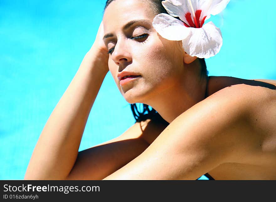 Wet woman with flower in hair. Wet woman with flower in hair