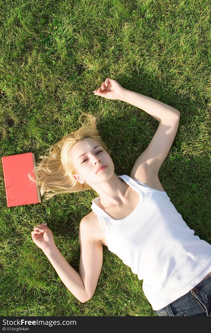 Blonde with book in the park