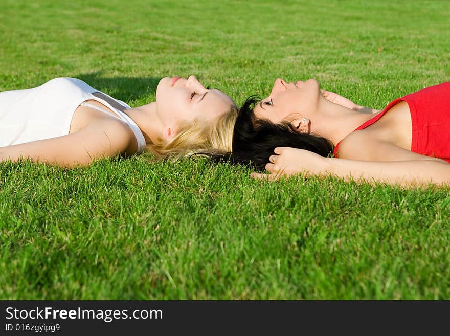 Women rest on the grass