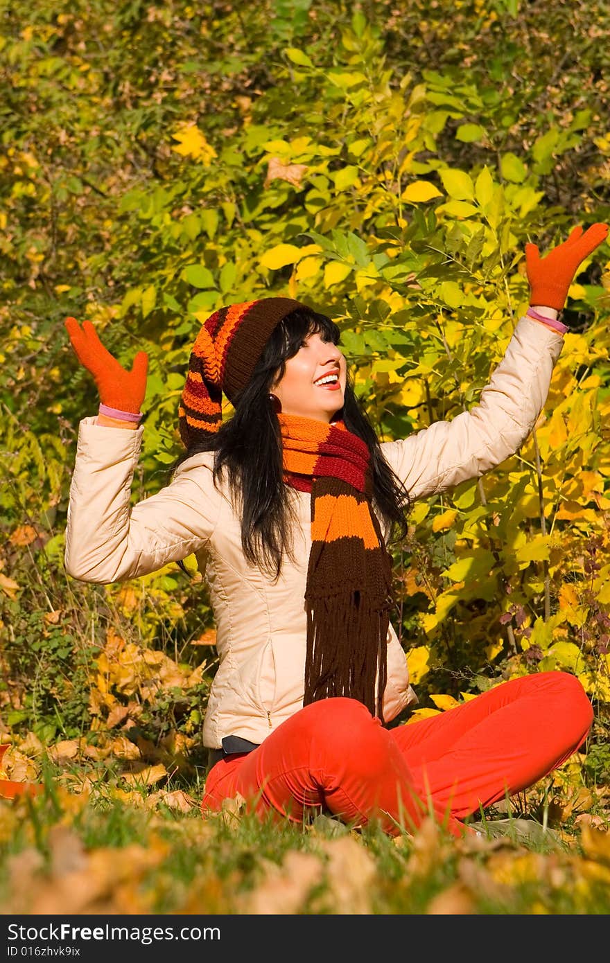 Young woman on the autumn leaf