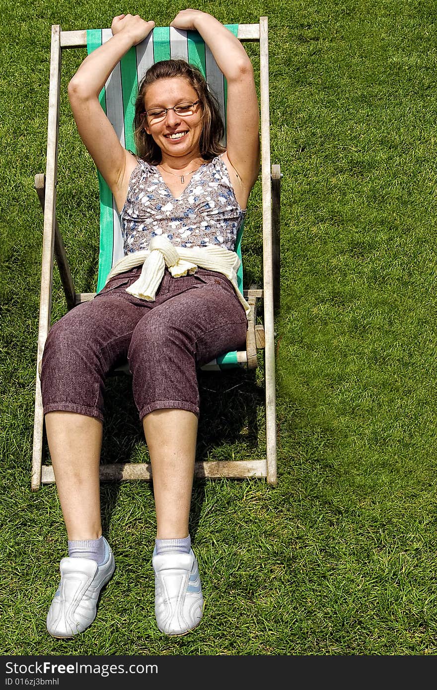 The girl siting at deckchair. The girl siting at deckchair