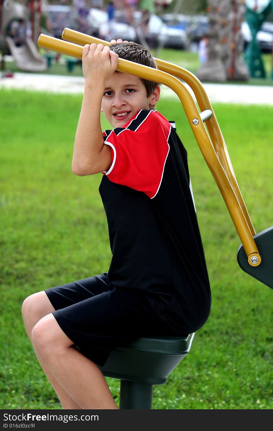 Teenager working  out in the park