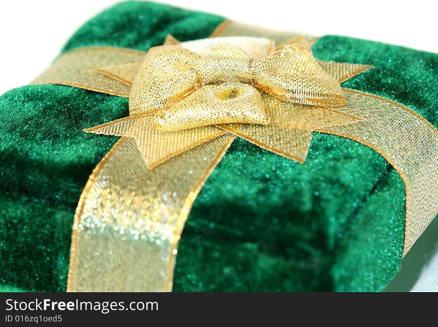 Green velvet gift box with gold ribbon decoration. Green velvet gift box with gold ribbon decoration