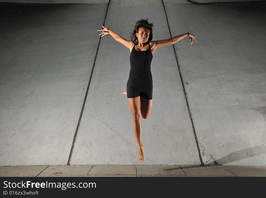 Artistic Picture of a Dancer performing athletic contemporary dance moves. Artistic Picture of a Dancer performing athletic contemporary dance moves.