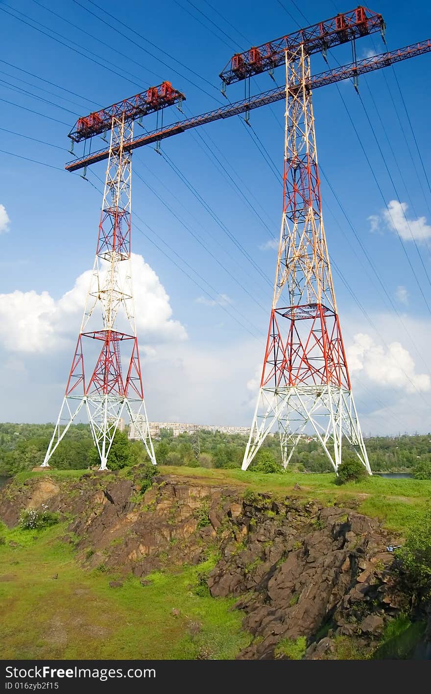 Electric main on the rock against the cloudy sky. Electric main on the rock against the cloudy sky