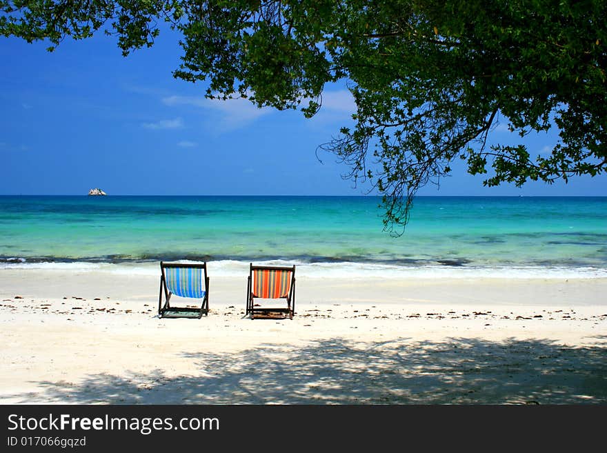 Beach chairs on Samed Island, Rayong, Thailand waiting for someone to sit and rest