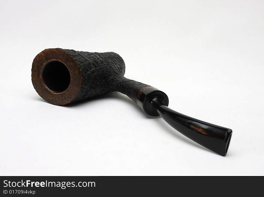 An black tobacco pipe isolated on white background from Denmark.