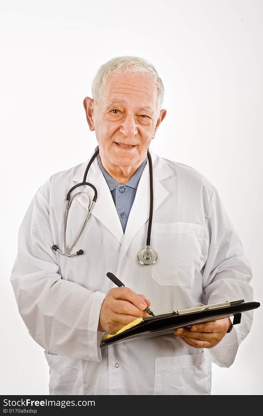 Senior doctor writing a prescription