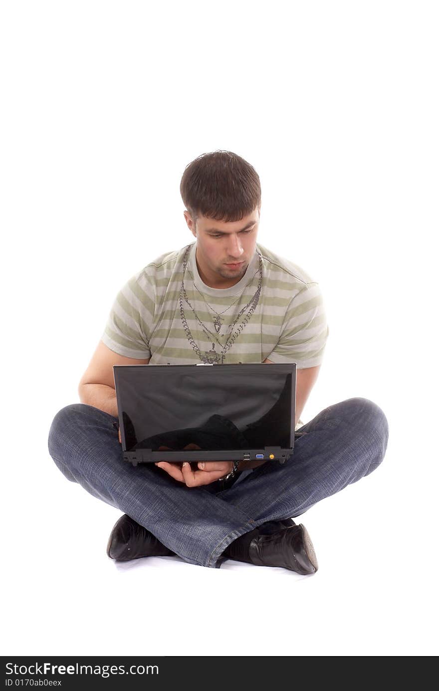 Contemporary looking guy working with laptop, isolated on white background. Contemporary looking guy working with laptop, isolated on white background