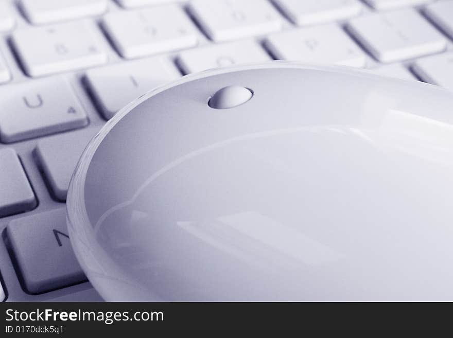 Mouse and white Keyboard of a laptop