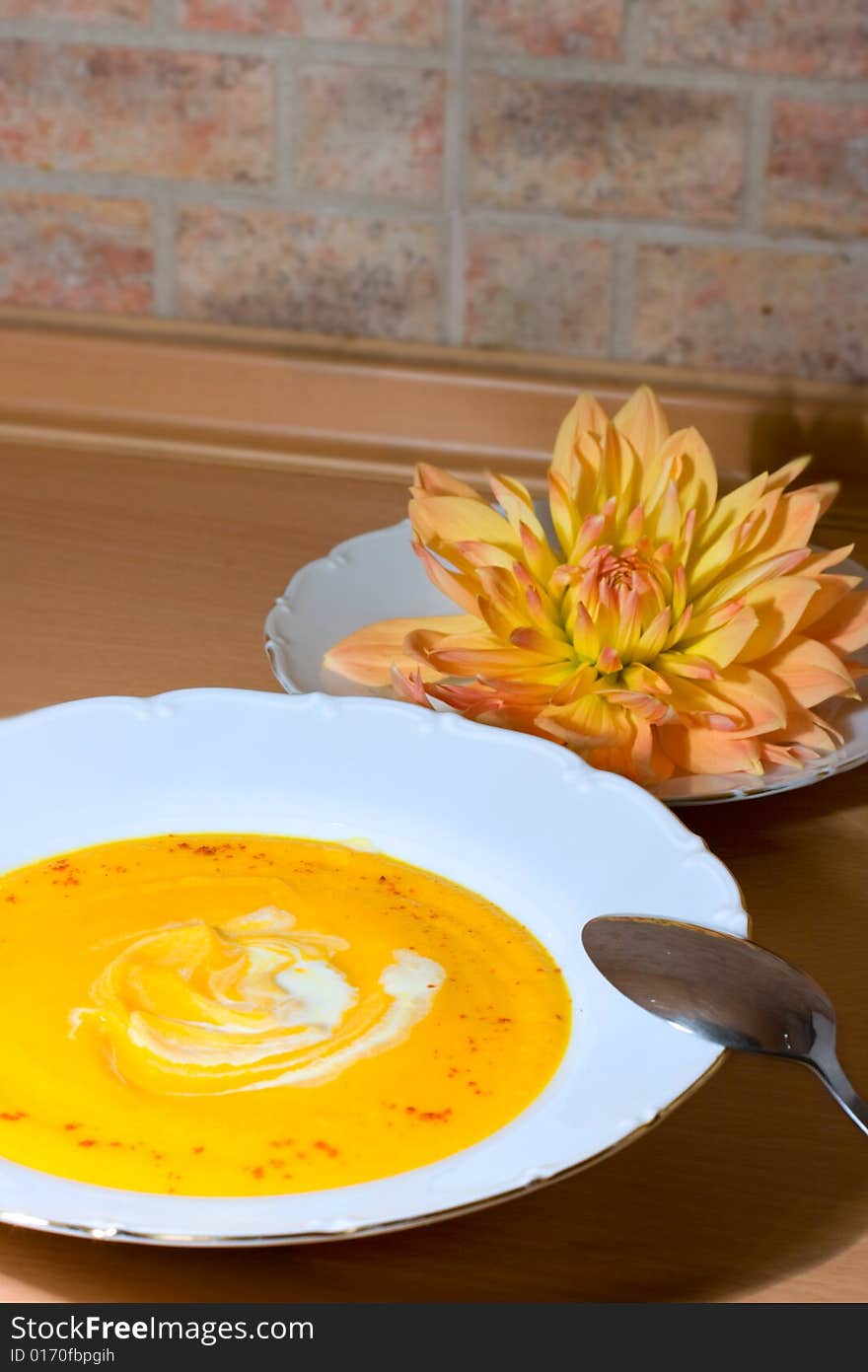 Tasty pumpkin soup with cream and paprika