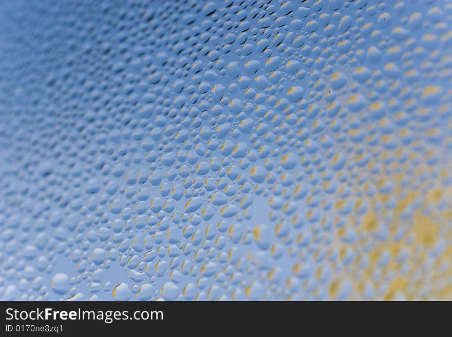 Raindrops on blue glass