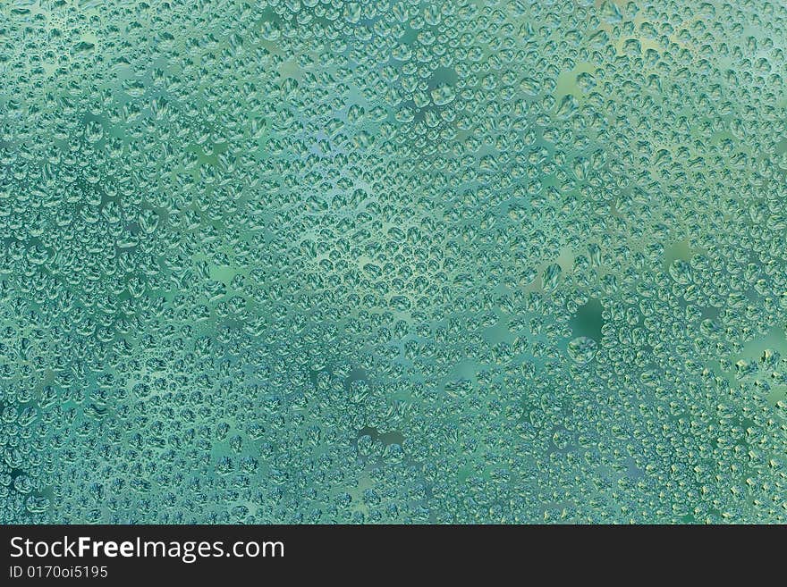 Abstract green background (raindrops on green glass)