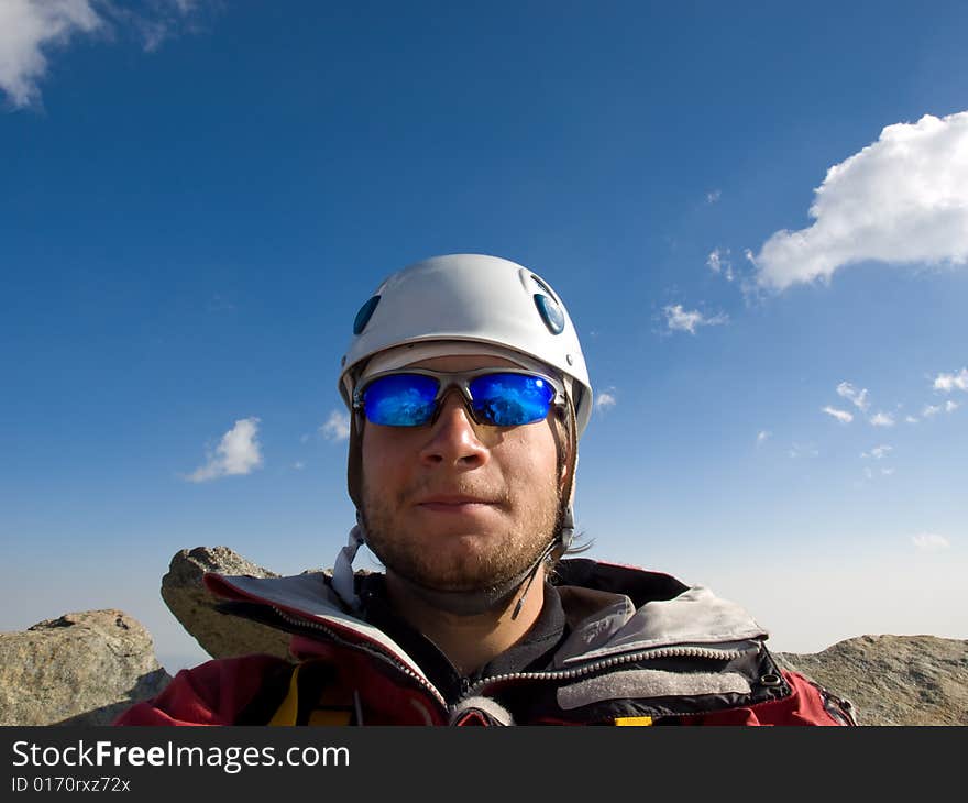 Climber on the top of mountain.