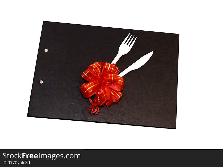 Plastic spoon and fork on a black file