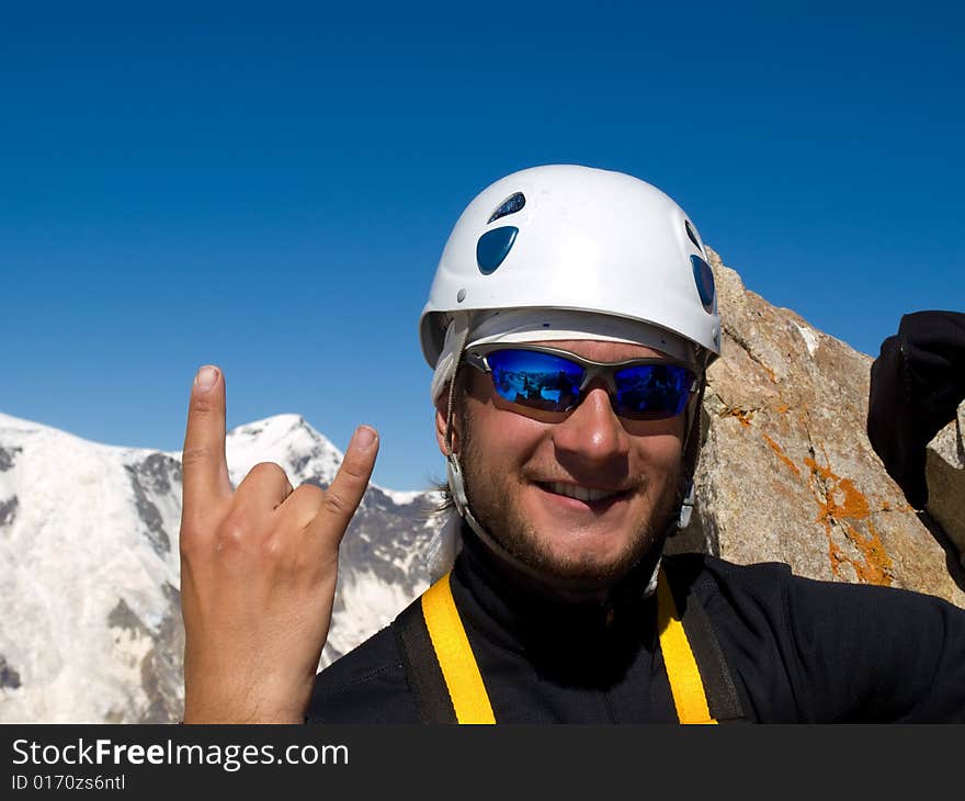 Climber on the top of mountain.