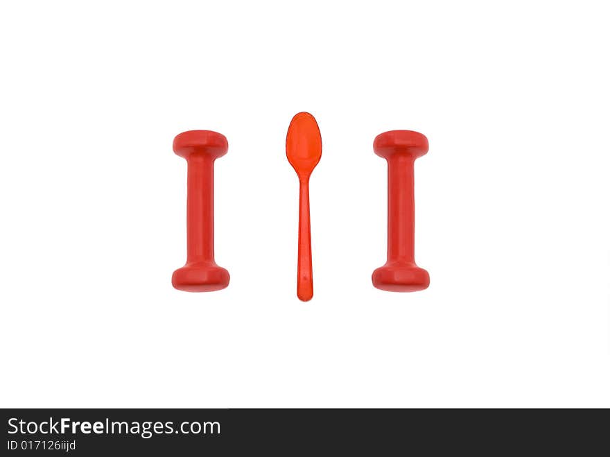 Two barbells and red plastic spoon isolated on white