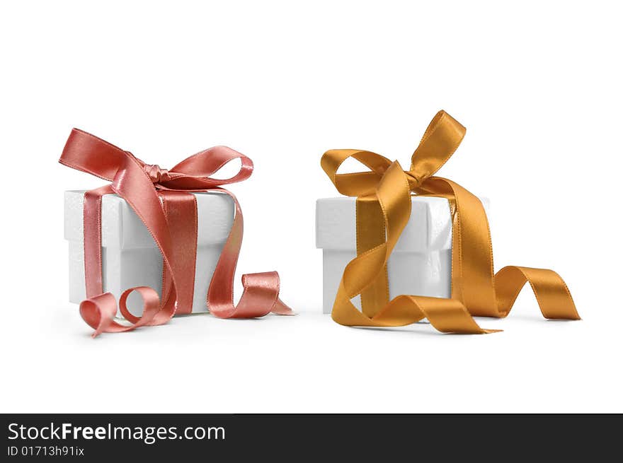 Two present boxes with ribbons isolated on white background