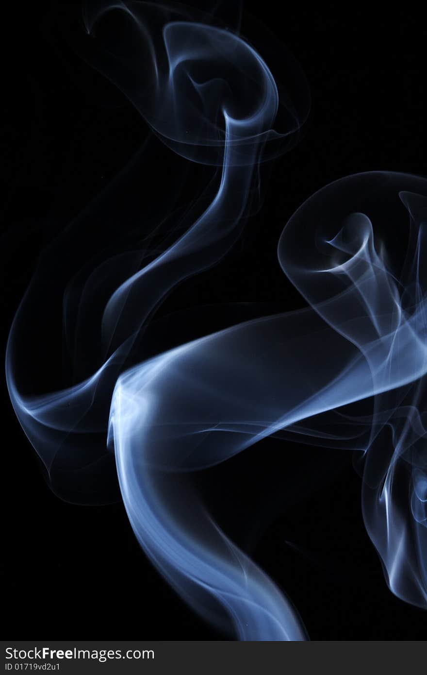 Abstract colored smoke on a black background