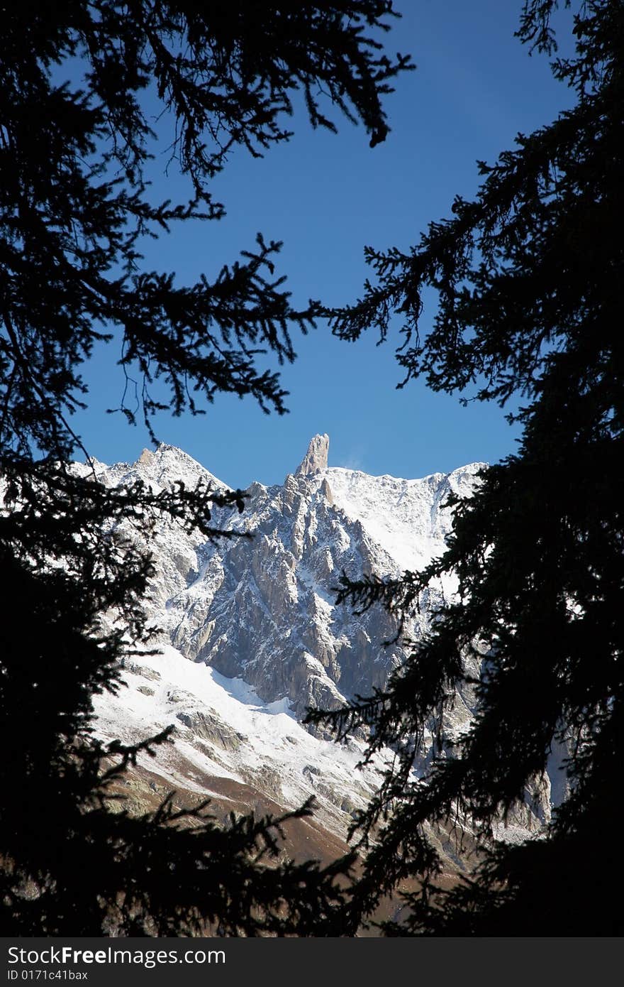 The famous sharp pinnacle of the Dent du Geant, Mont Blanc Massif, Courmayeur, Italy. The famous sharp pinnacle of the Dent du Geant, Mont Blanc Massif, Courmayeur, Italy