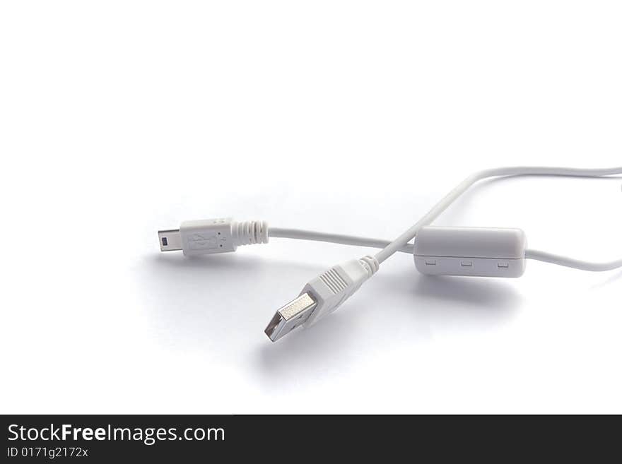 Cables USB and mini USB on white background