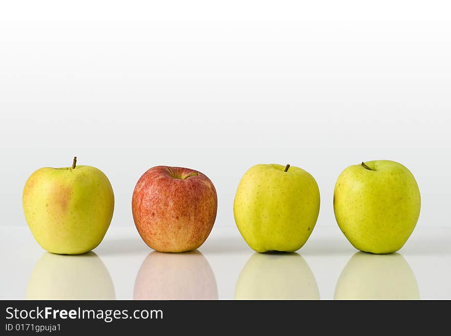 A composition of green apples and red apple