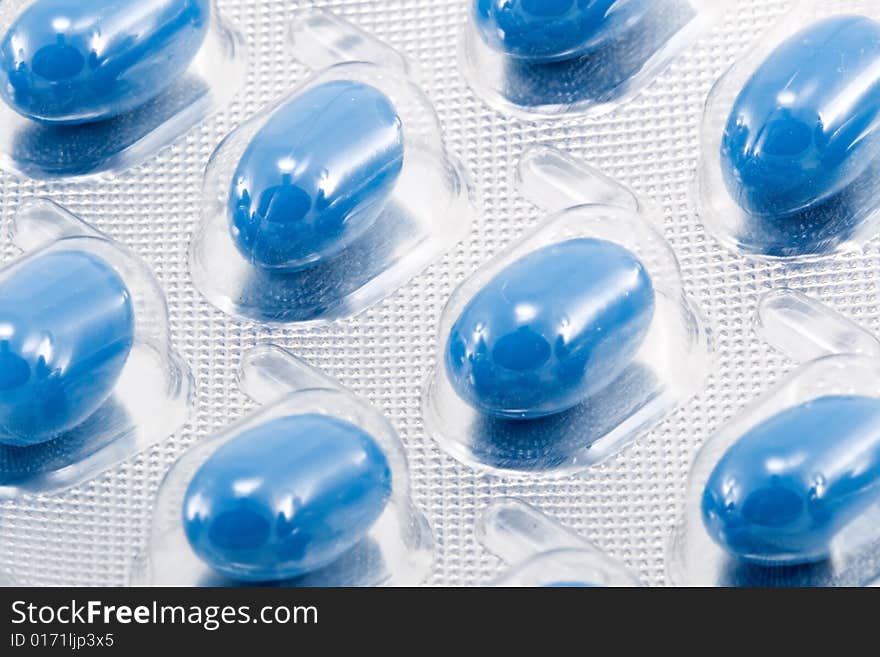 Blue oval medical pills in their packages. Blue oval medical pills in their packages