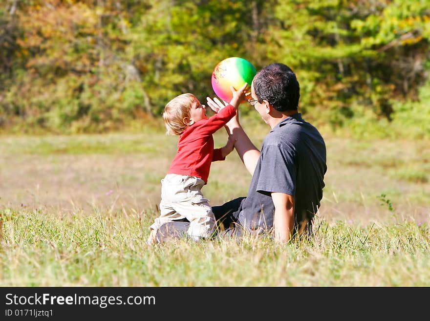 Father playing with son outdoors