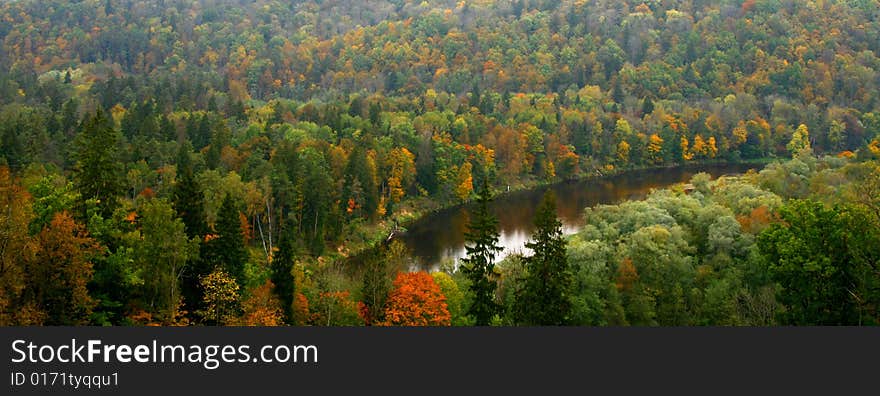 Colorful autumn valley with river