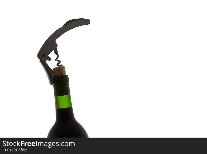 A corkscrew in opening a bottle of wine in the studio