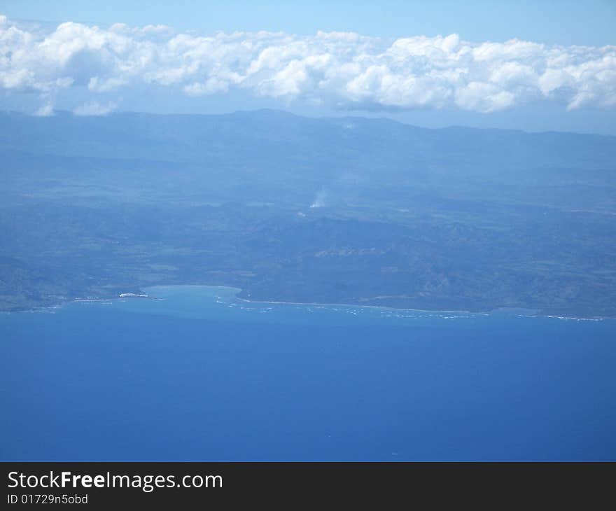 Ocean and land viewed from a plane