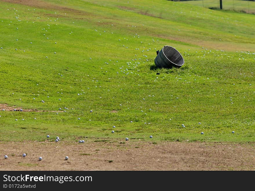 Golf balls on green grass field