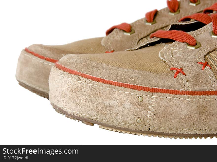 Toecaps of the plimsolls. Close-up, isolated on white.