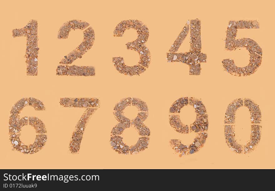 Stones and sands numerals isolation isolated on brown