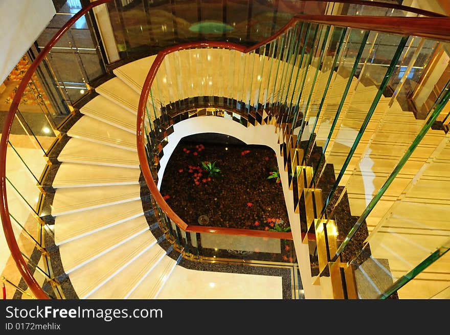 The ceramic curving upward staircase in a luxury hotel.