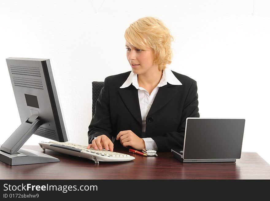 Young business woman working in a modern office.Isolated over white.