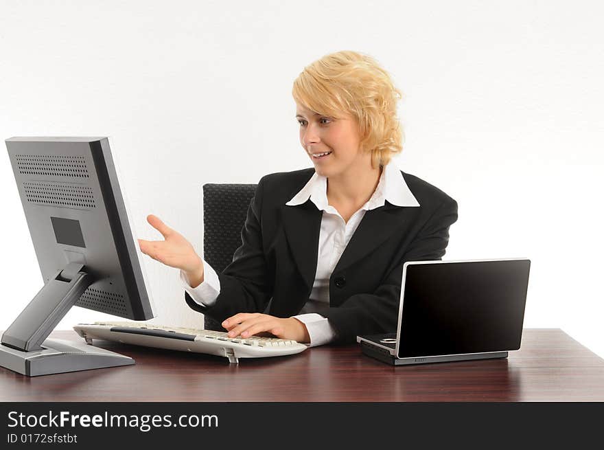 Young business woman working in a modern office.Isolated over white.