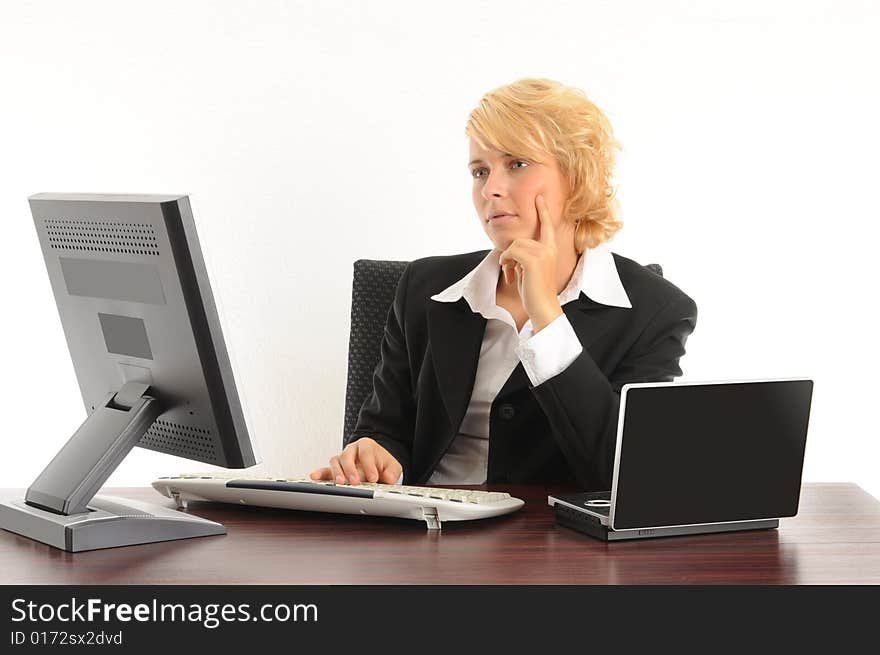 Young business woman working in a modern office.Isolated over white.