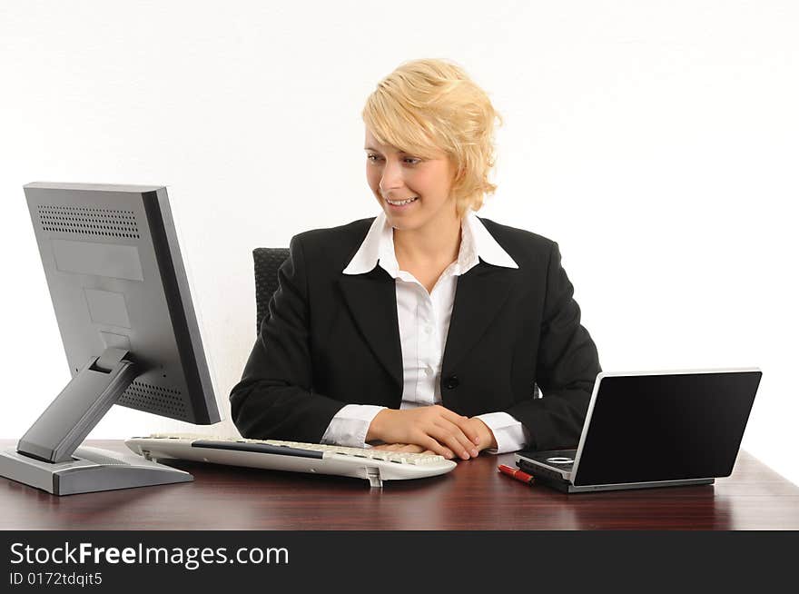 Young business woman working in a modern office.Isolated over white.